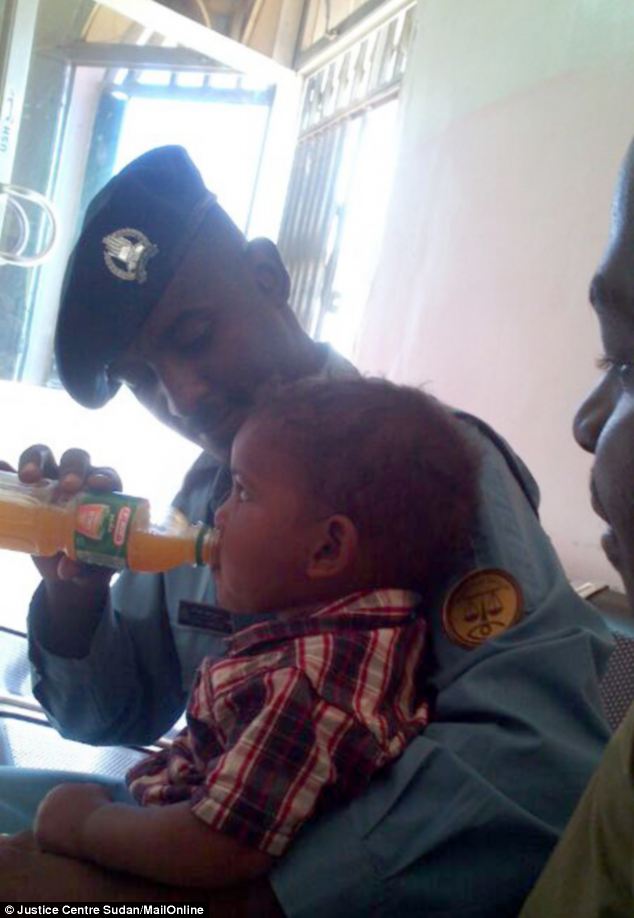 Policefeedingbaby.jpg Hosting at Sudaneseonline.com